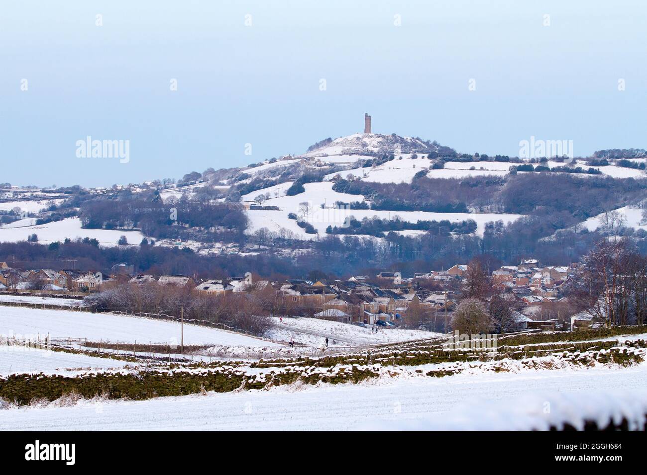 Honley Castle Hill seen from Honley Village in the snow Stock Photo - Alamy