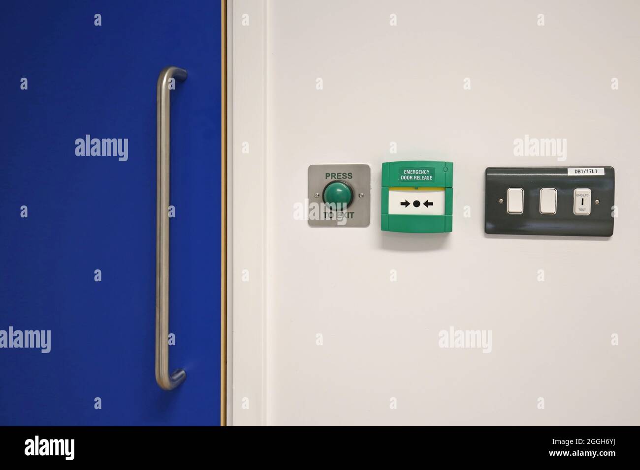 Electronic door release controls next to a laminated door in a new