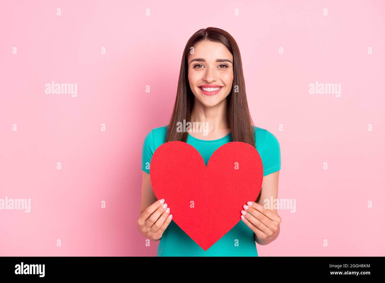 Photo of young woman happy positive smile hold big red paper heart ...