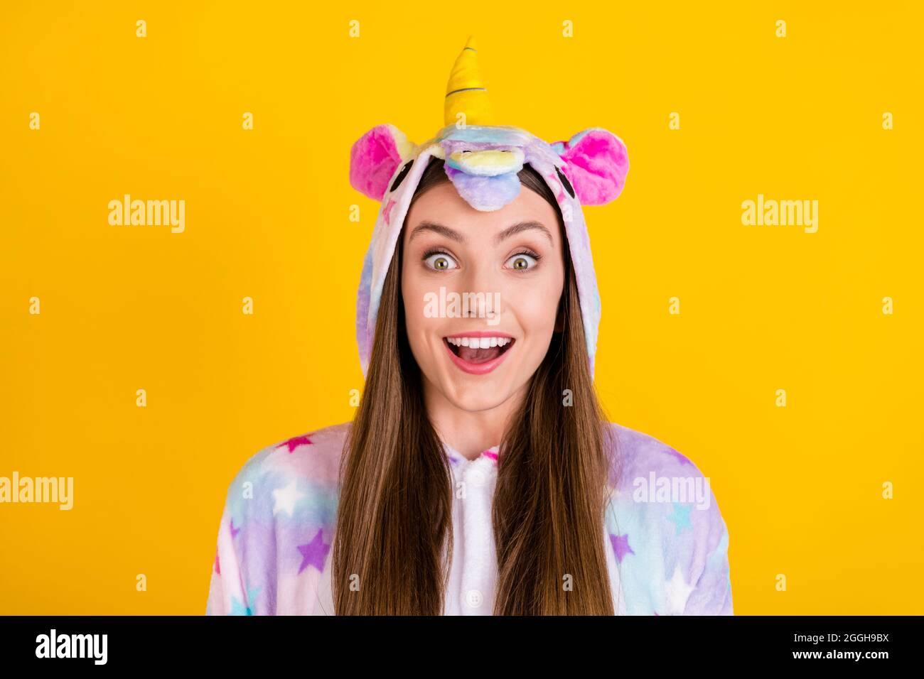 Portrait of attractive cheerful amazed girl wearing animal look good mood having fun isolated over bright yellow color background Stock Photo