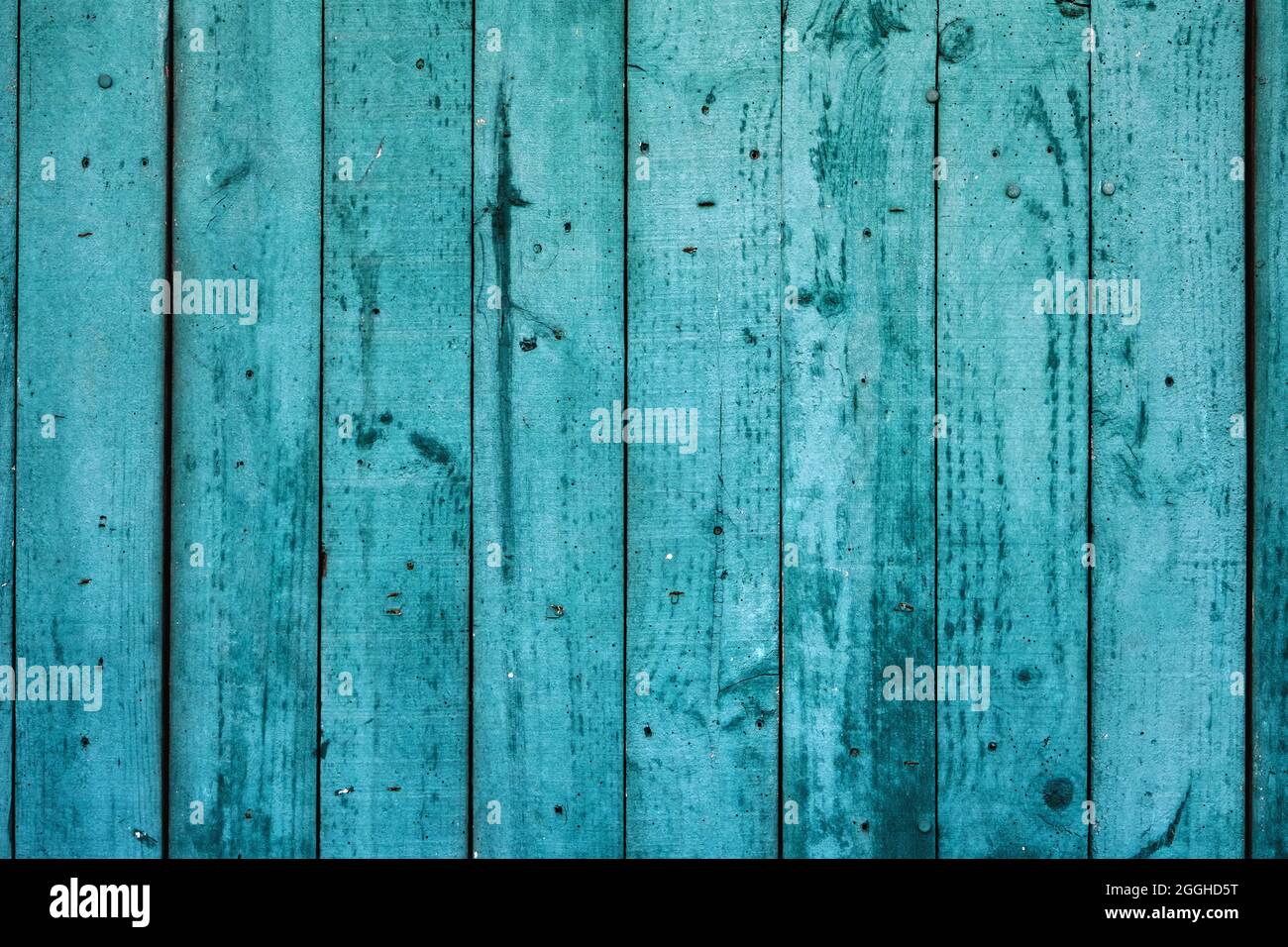 Old weathered turquoise colored wooden wall, rustic background or texture Stock Photo