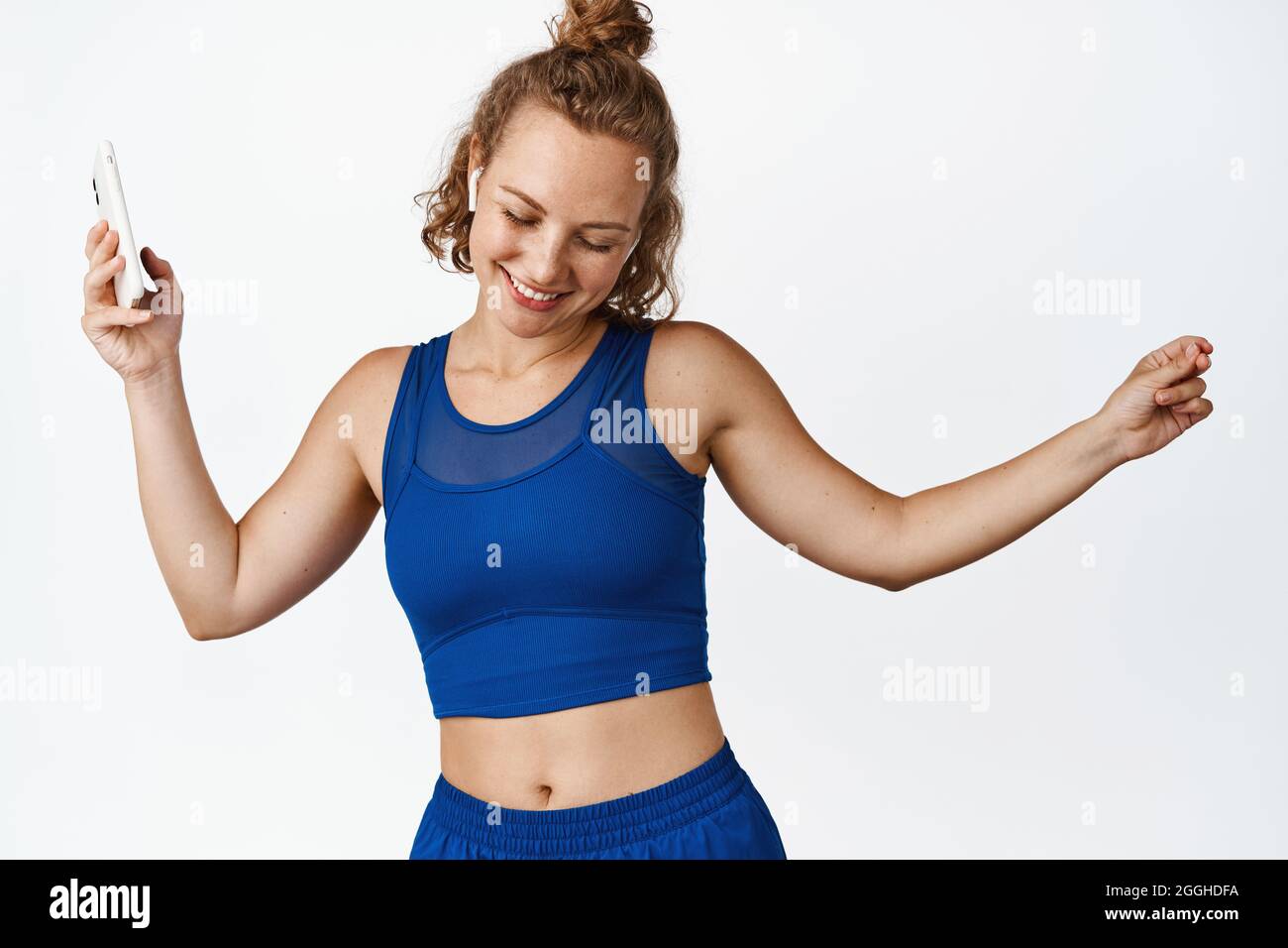 Woman in gym clothes wearing hi-res stock photography and images