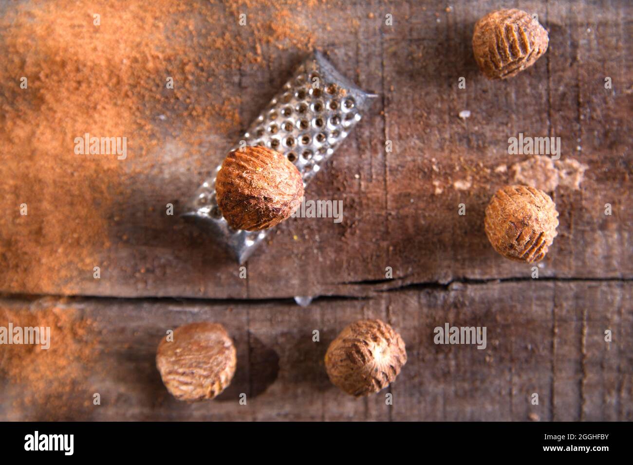 Detail of the grating of nutmeg flavor unique to particular foods and