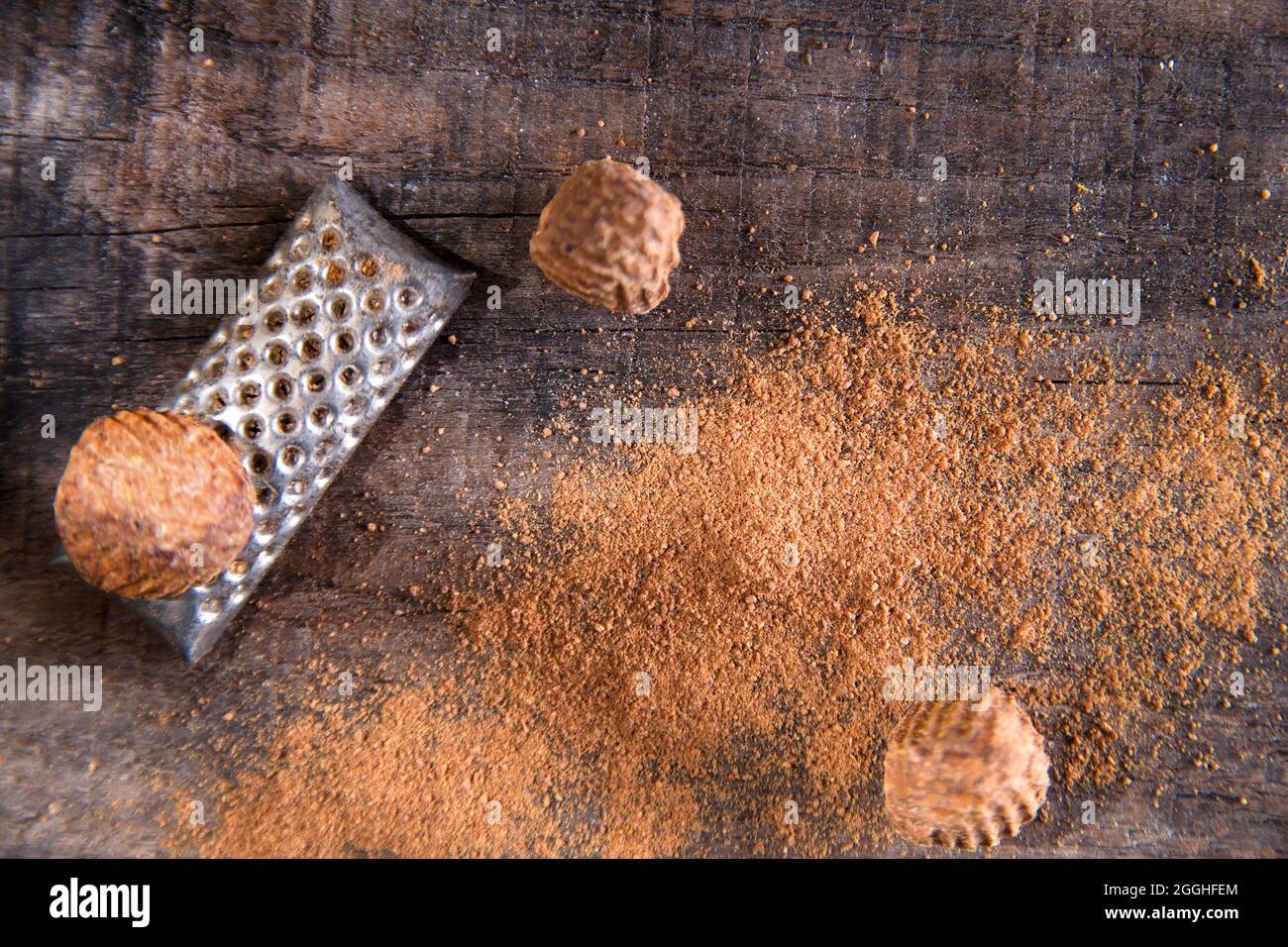 Detail of the grating of nutmeg flavor unique to particular foods and