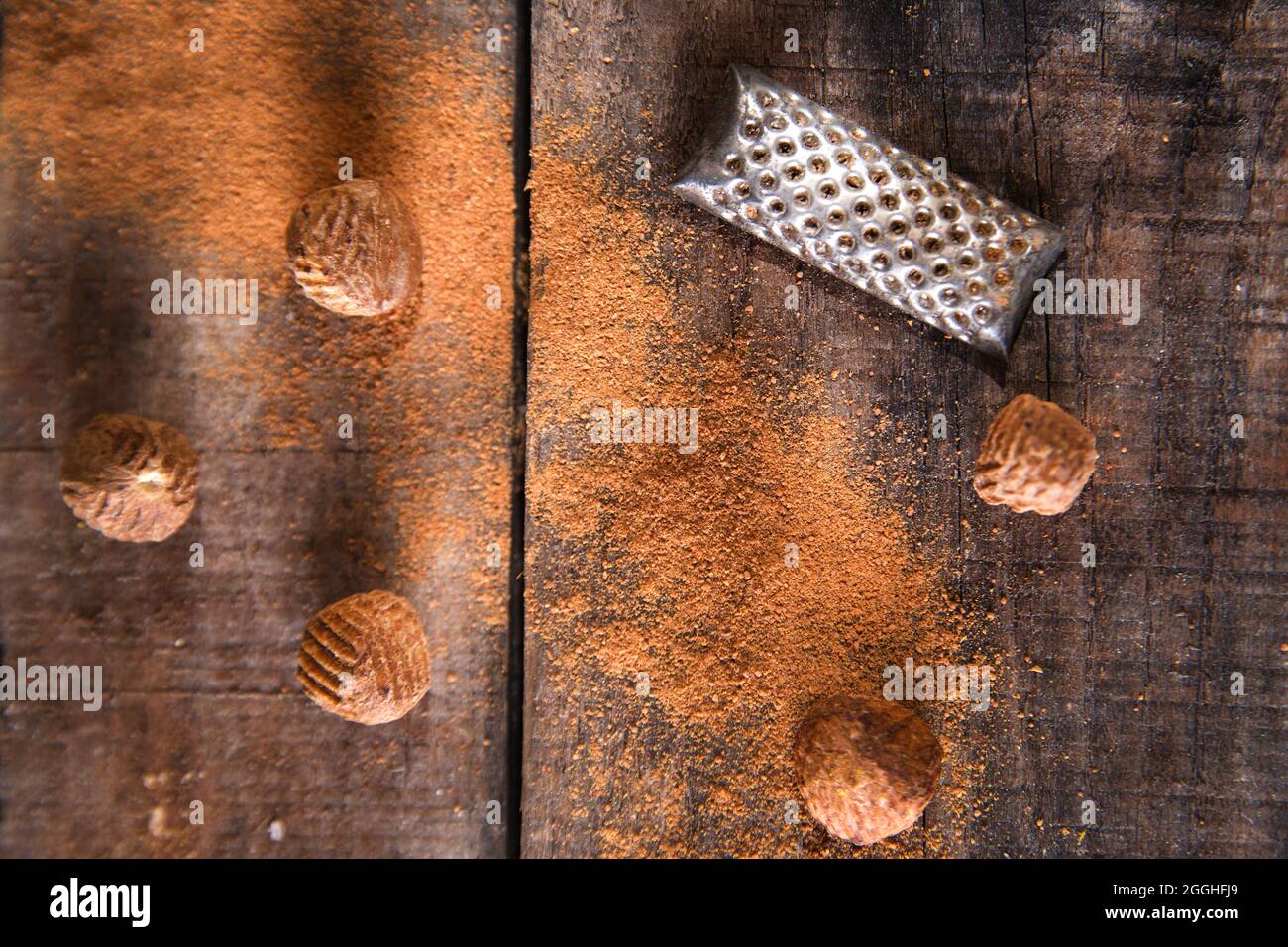 Detail of the grating of nutmeg flavor unique to particular foods and