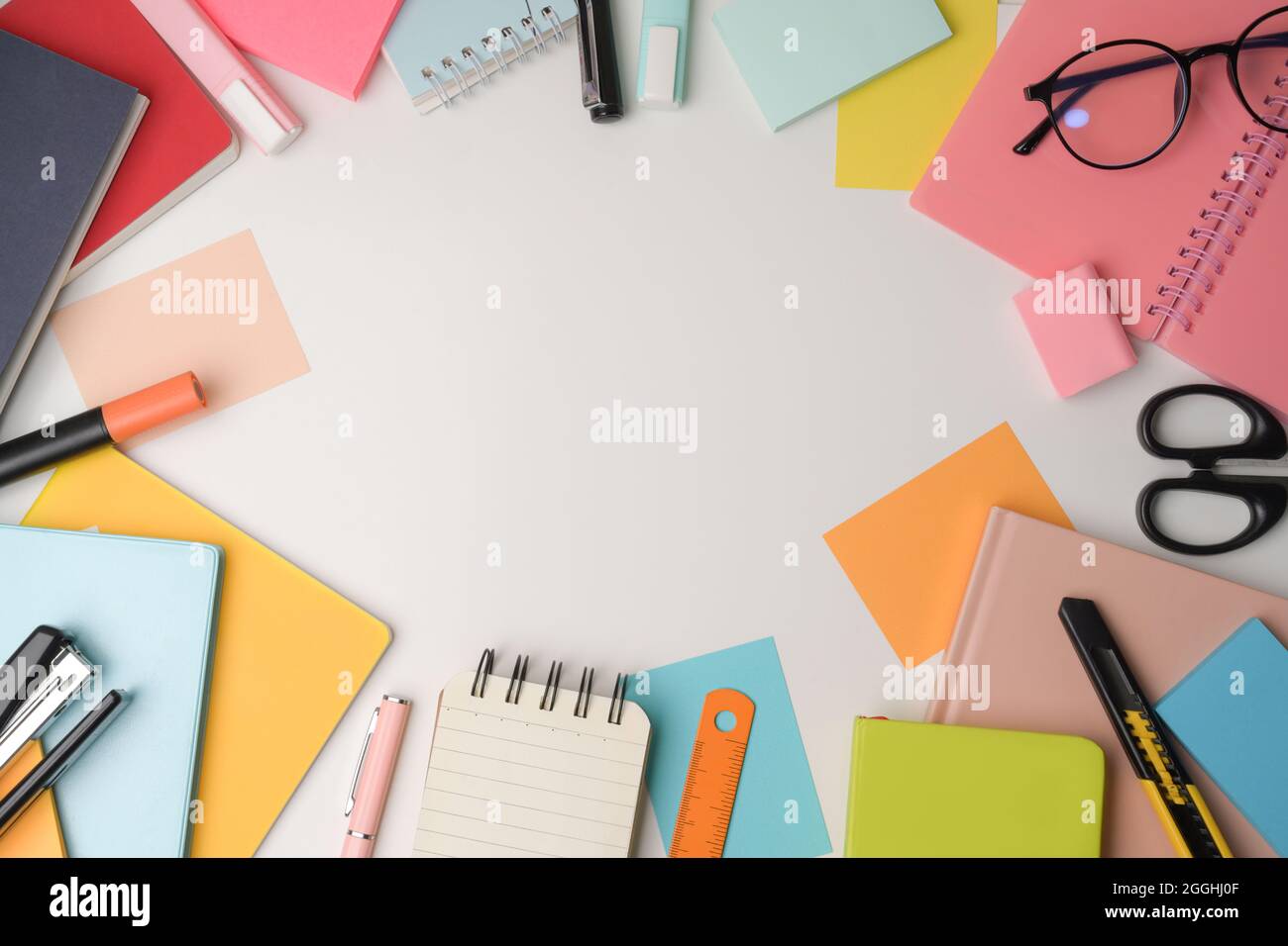 Colorful notebooks and stationery on white background Stock Photo - Alamy