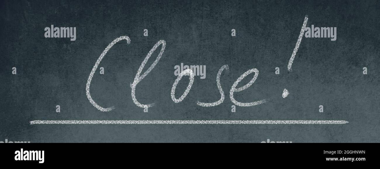 The word close standing on a blackboard, handwritten with chalk Stock