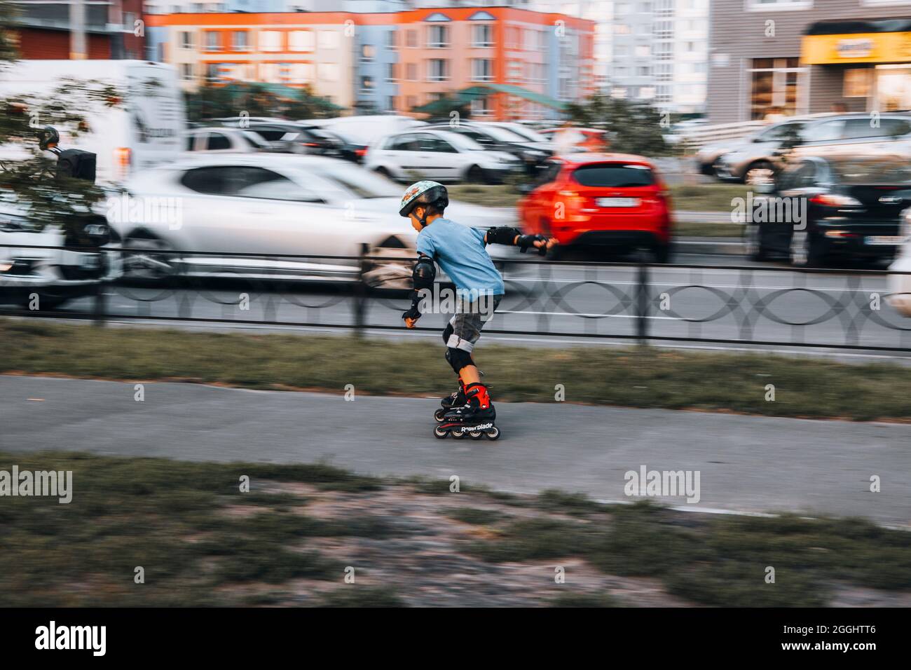 Ukraine, Kyiv - 27 June 2021: Boy training for inline skates. Rollerblade  Inline Skates, Author Helmet, Powerslide Protection. Editorial Stock Photo  - Alamy