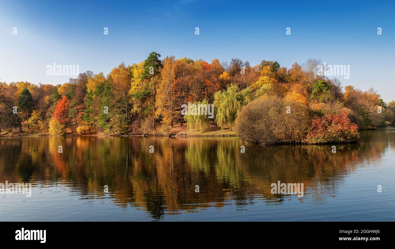 Beautiful autumn landscape with reflection in the lake. Beautiful autumn scenery. Stock Photo