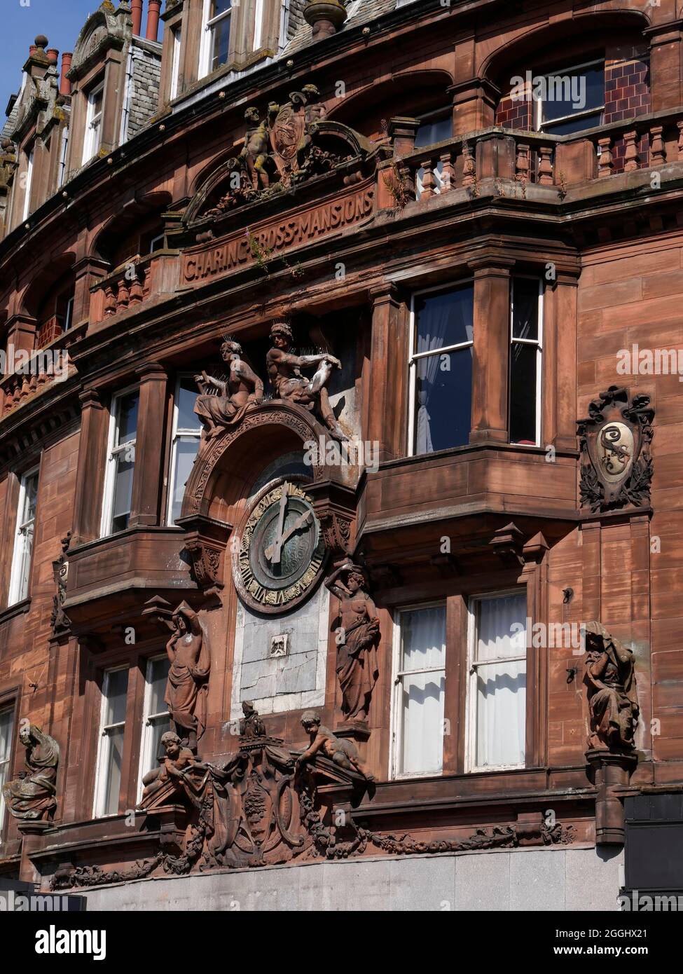 detail of the elegant red sandstone facade of Charing Cross Mansions