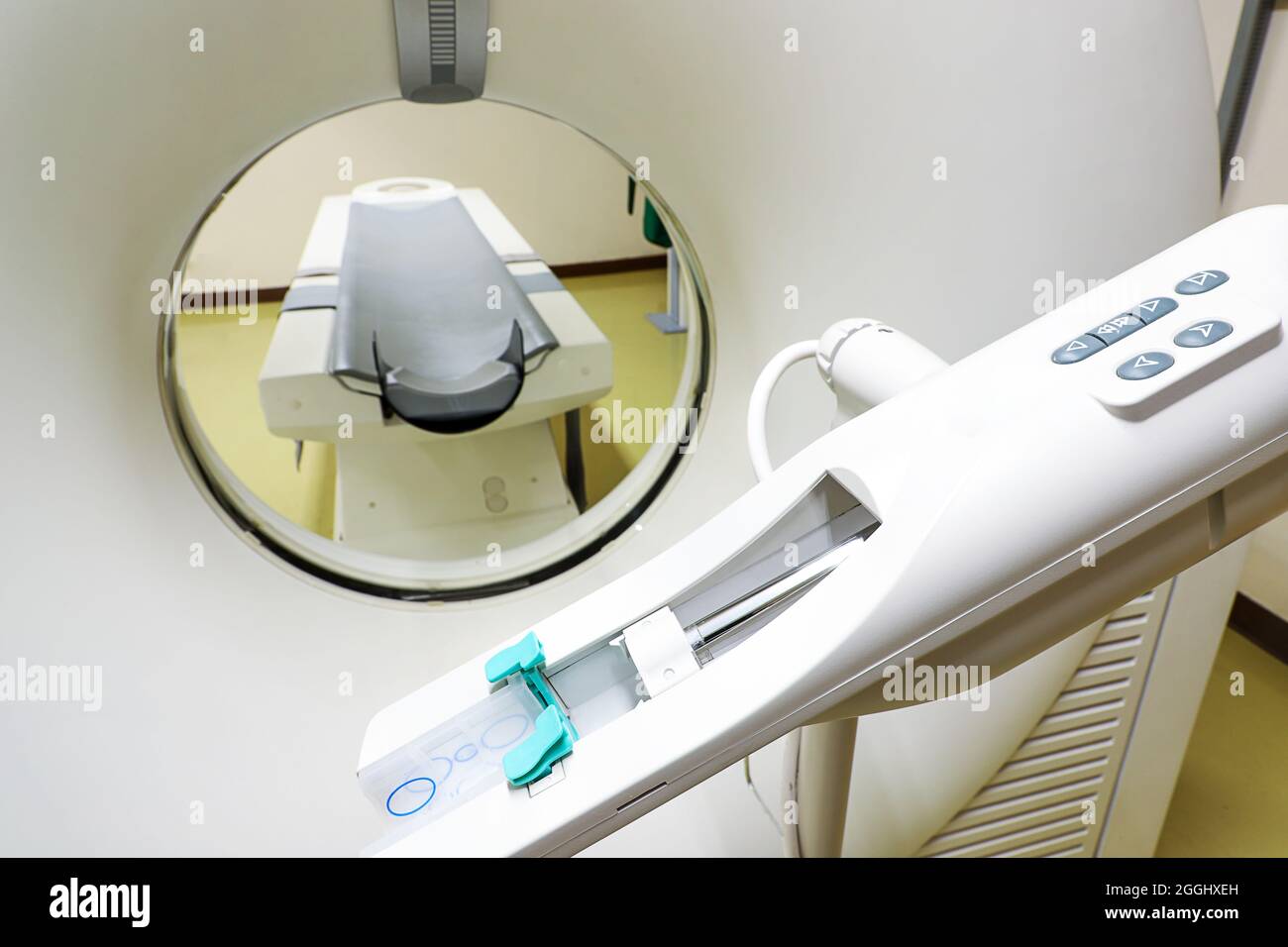 a computer tomography scanner (CT) and a contrast media injector in the radiology department Stock Photo