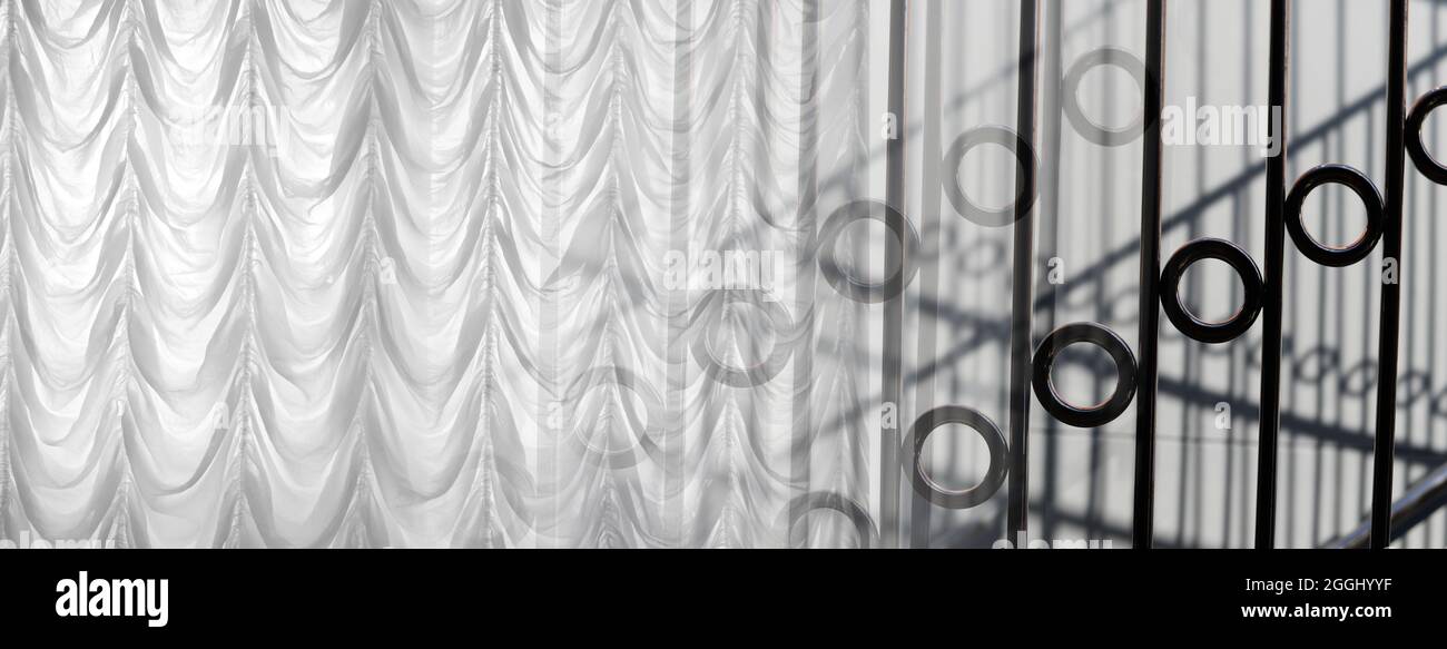 soft white drapery curtain with black curved steel interior decoration