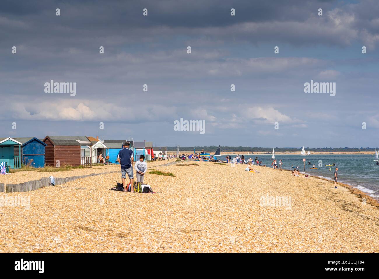 People on a busy day at Calshot Beach during summer, Calshot, Hampshire, England, UK Stock Photo