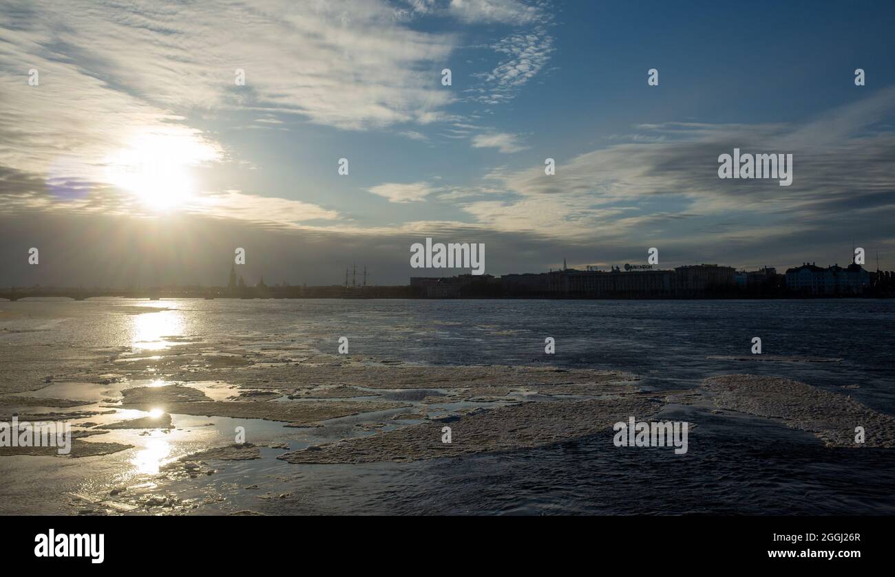 March 30, 2019. Ice floes on the melting Neva River in St. Petersburg against the setting sun Stock Photo