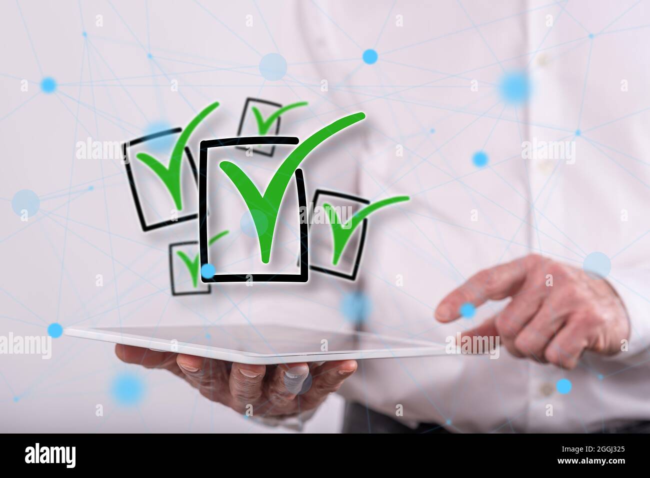 Validation concept above a tablet held by a man in background Stock Photo