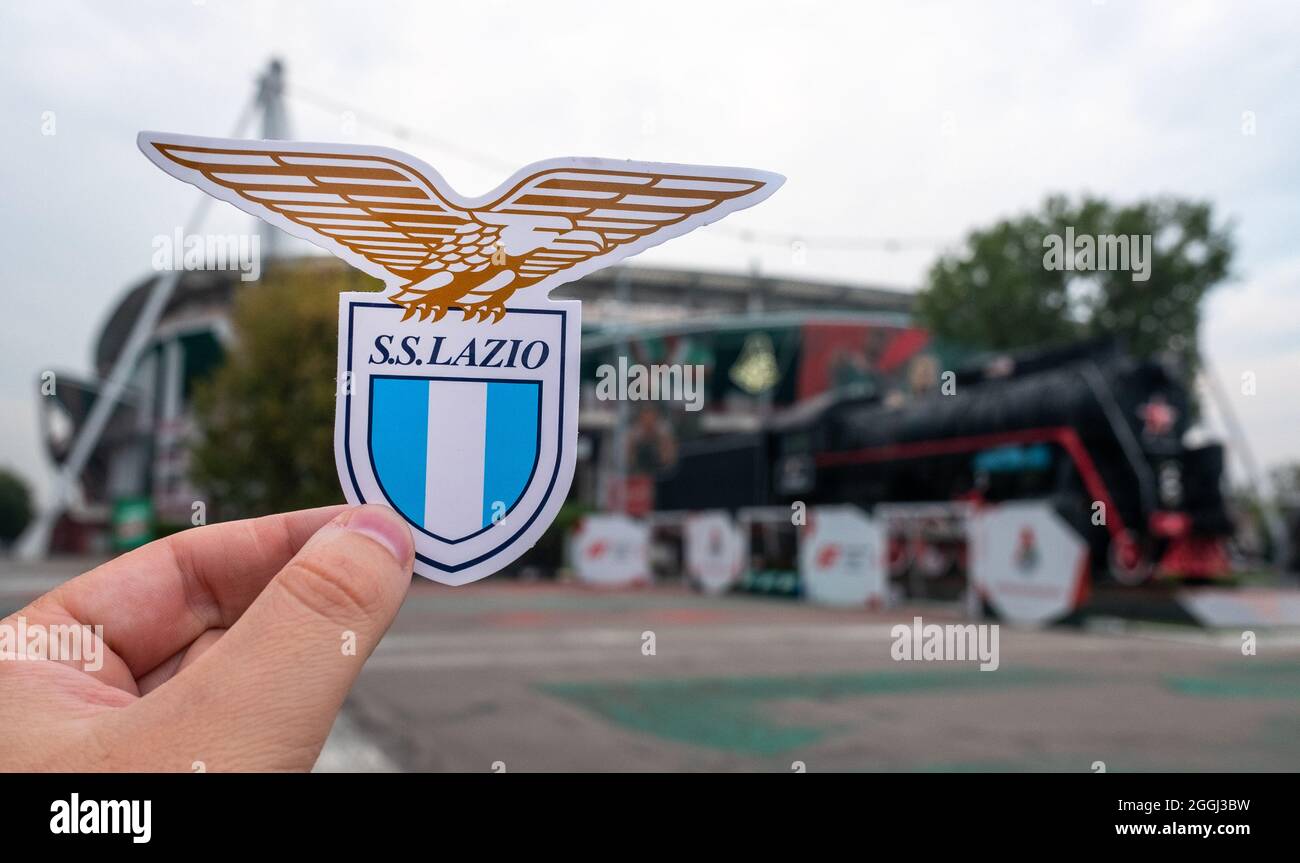 august-30-2021-moscow-russia-the-emblem-of-the-lazio-football-club-against-the-background-of-the-russian-railways-arena-stadium-of-the-lokomotiv-m-2GGJ3BW.jpg