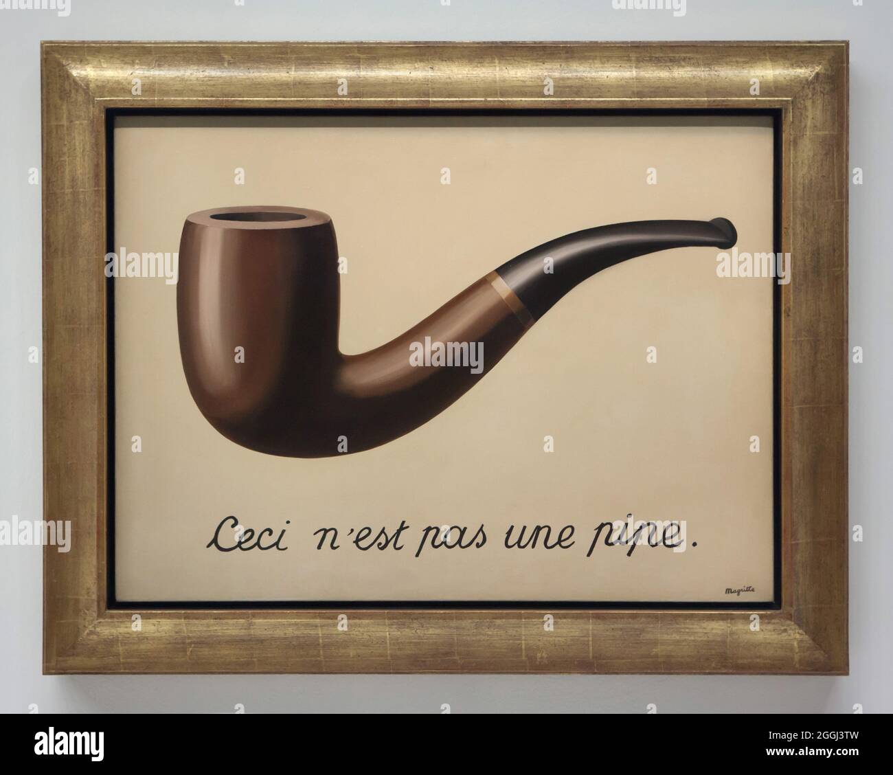 Painting 'La trahison des images' ('The Treachery of Images') by Belgian surrealist artist René Magritte (1929) on display at his retrospective exhibition in the Centre Pompidou in Paris, France. The French inscription 'Ceci n'est pas une pipe' means 'This is not a pipe'. The exhibition runs till 23 January 2017. After that the exhibition will be presented at the Schirn Kunsthalle in Frankfurt am Main, Germany, from 10 February to 5 June 2017. Stock Photo