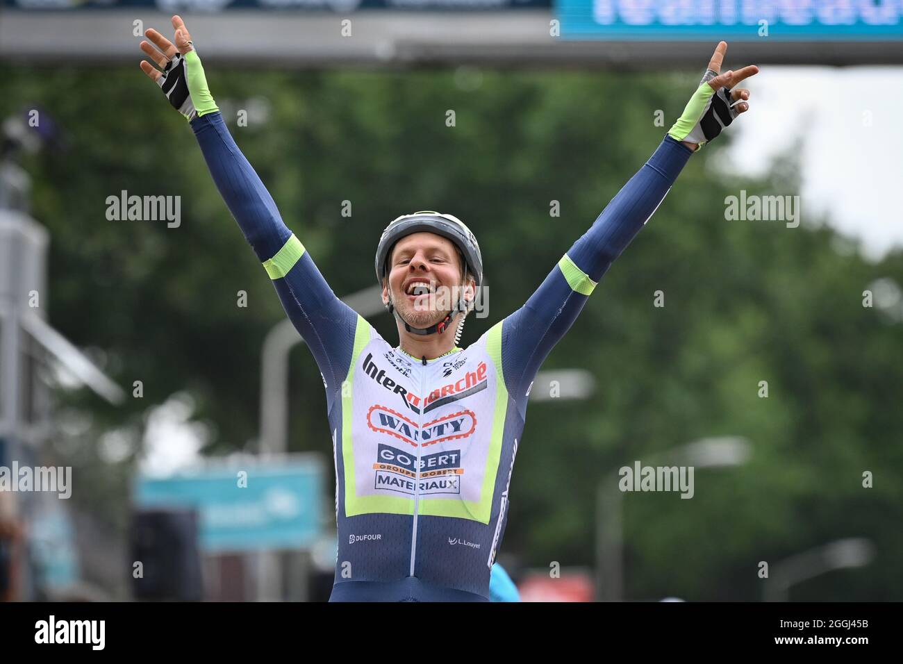 Dutch Taco van der Hoorn of Intermarche Wanty-Gobert Materiaux celebrates as he crosses the finish line to win the third stage of the Benelux cycling Stock Photo