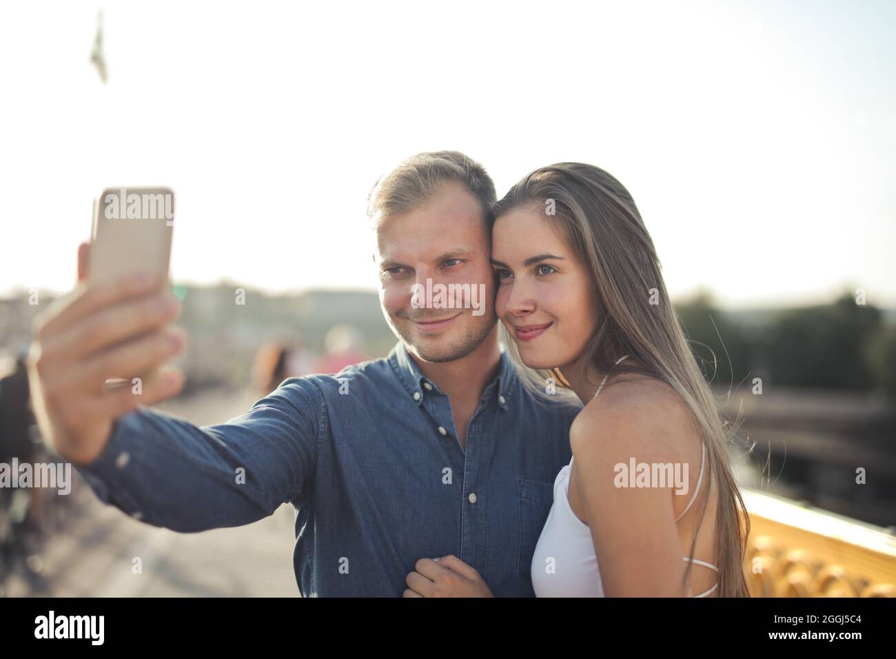 young woman takes a selfie on the street Stock Photo