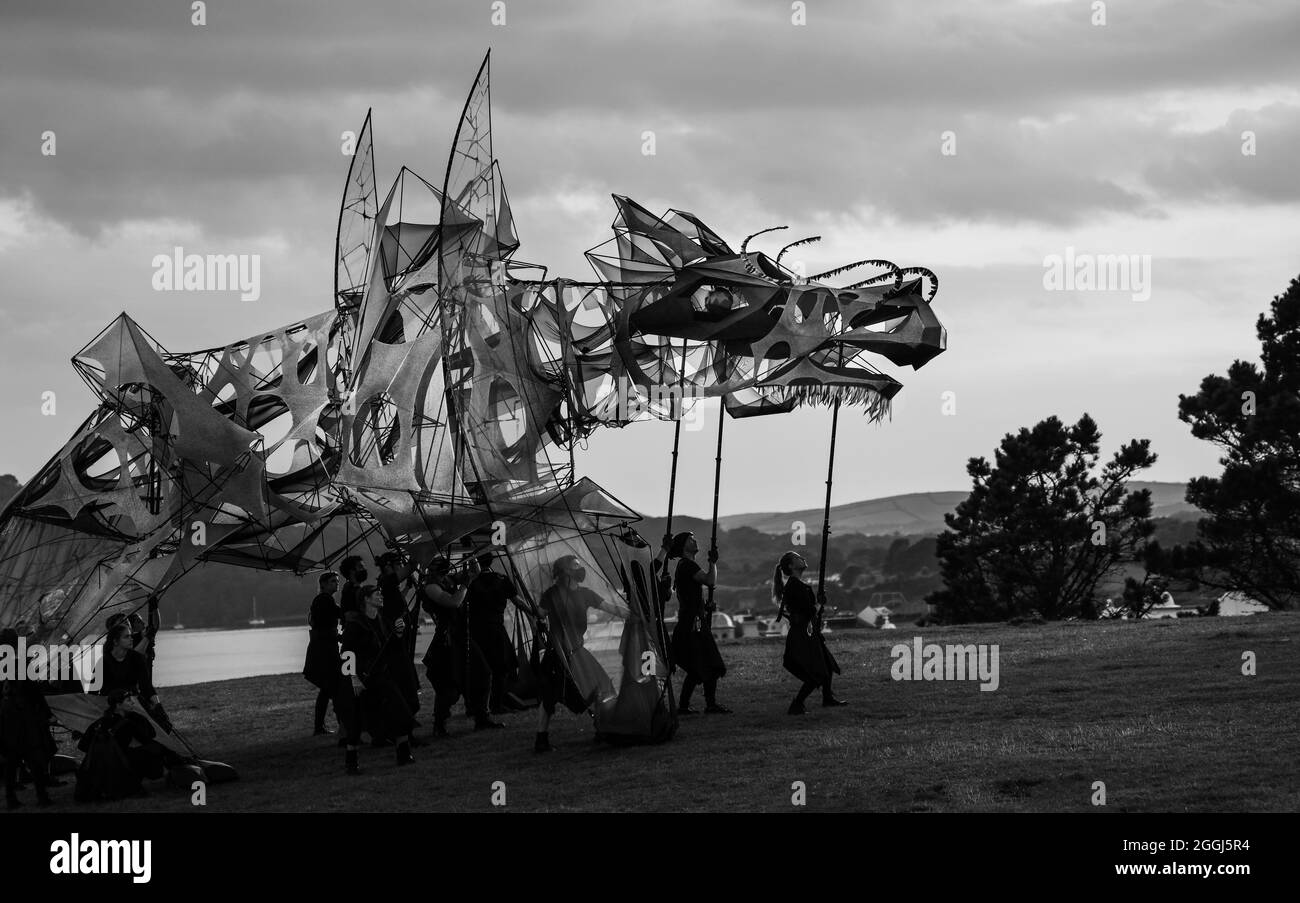 A monochrome shot of The Hatchling, a gigantic dragon puppet, towards the end of its first appearance over Bank Holiday Weekend on Plymouth Hoe. The g Stock Photo