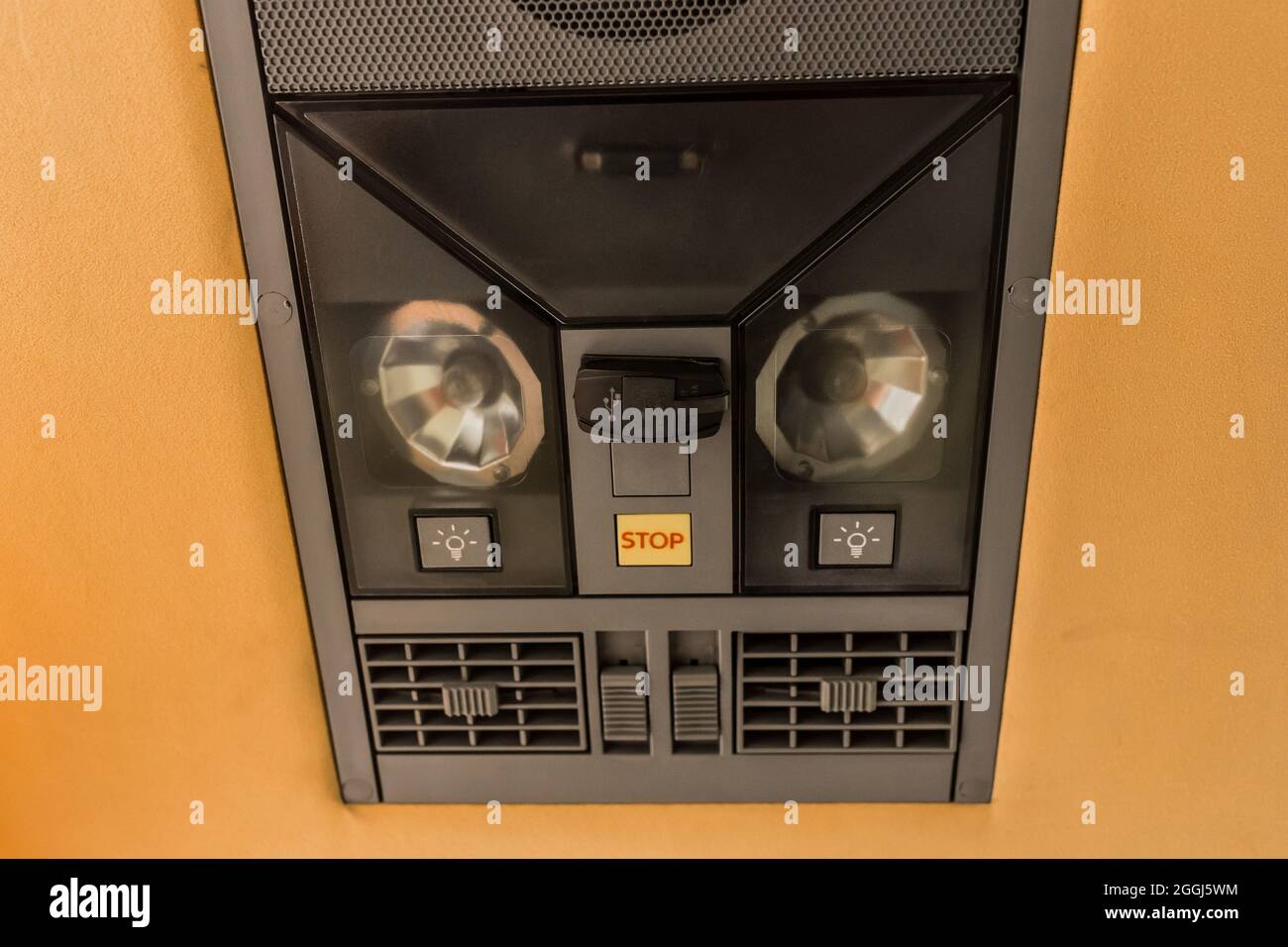 System and control panel for passengers in a tourist bus with buttons for adjusting the air conditioner, sound, light and speakers in the cabin of tra Stock Photo