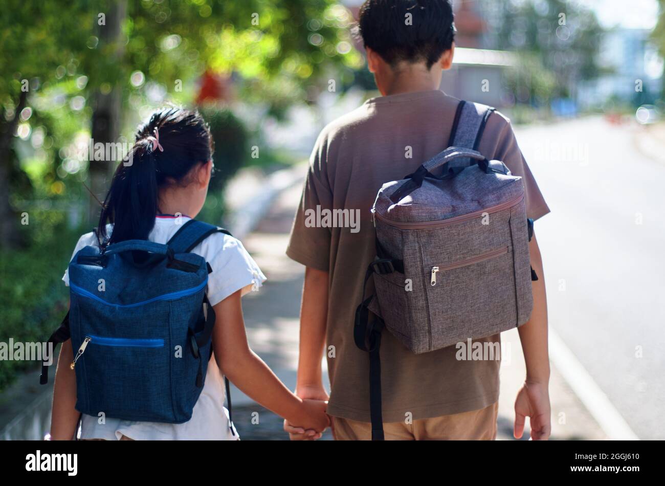 Brother and sister back to school COVID-19 pandemic Stock Photo