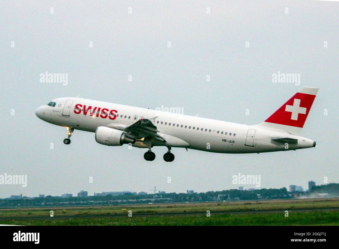 HB-JLR Swiss Airbus A320 Airplane is departing from Polderbaan 18R-36L of Schiphol Amsterdam Airport the Netherlands Stock Photo