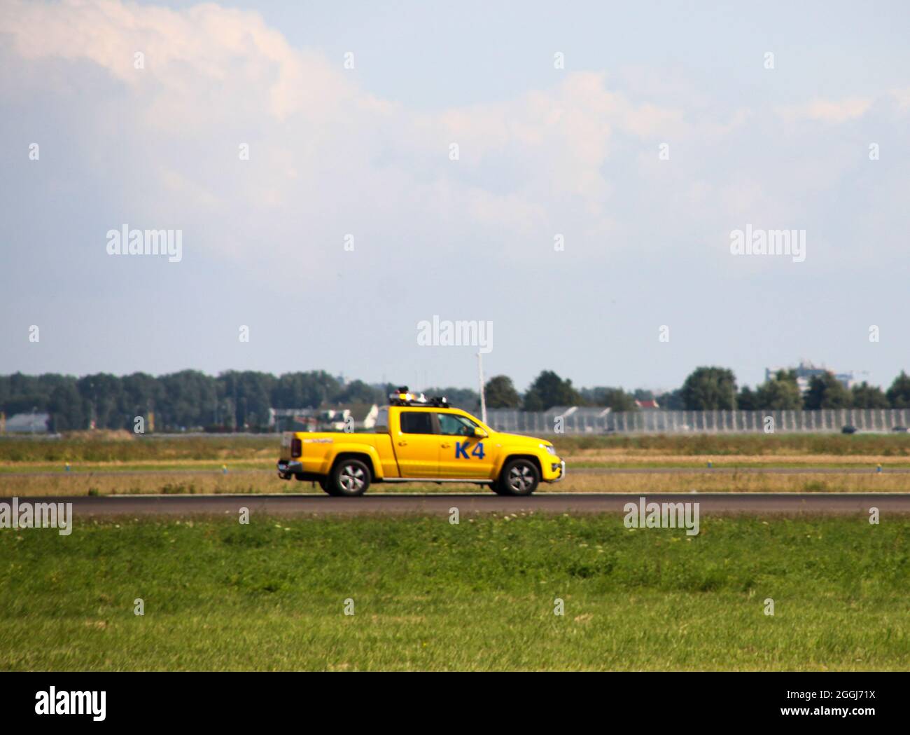 K4 bird control vehicle at Polderbaan 18R-36L of Schiphol Amsterdam Airport the Netherlands Stock Photo