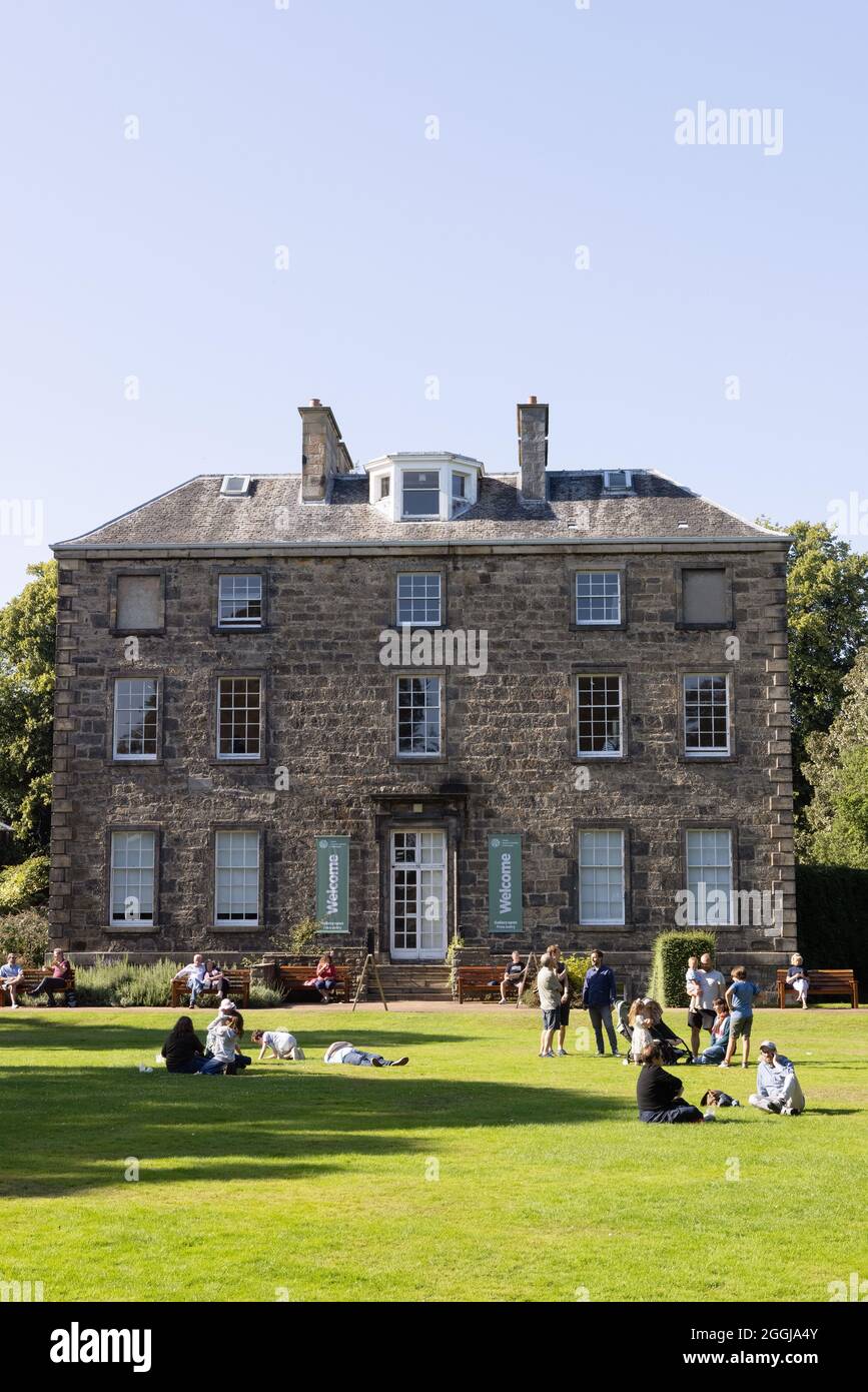 People enjoying a sunny summer day in front of Inverleith House, Royal Botanic Garden Edinburgh, Edinburgh Scotland UK Stock Photo