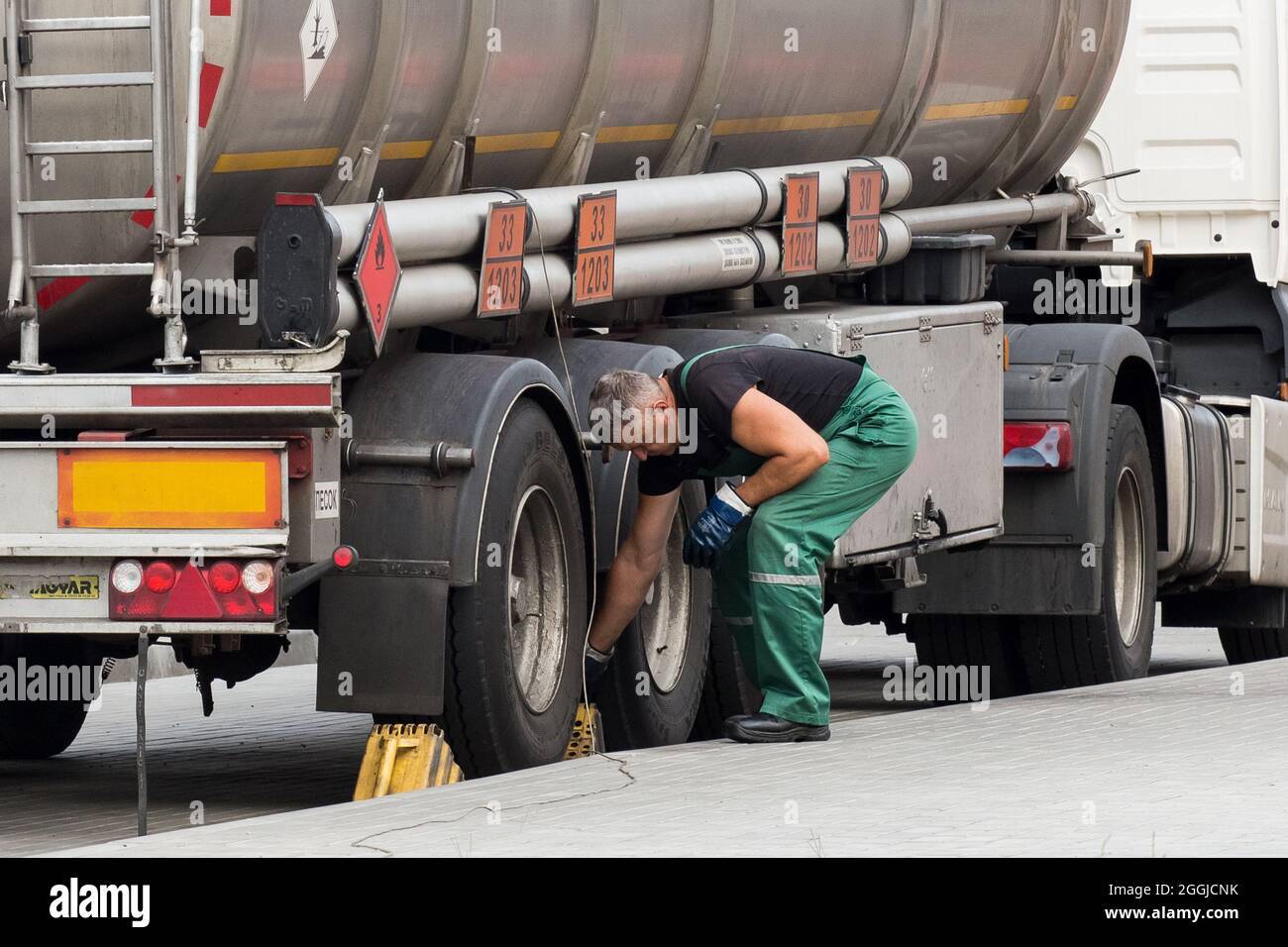 Belarus, Gomel region - August 21, 2020: A truck driver in overalls ...