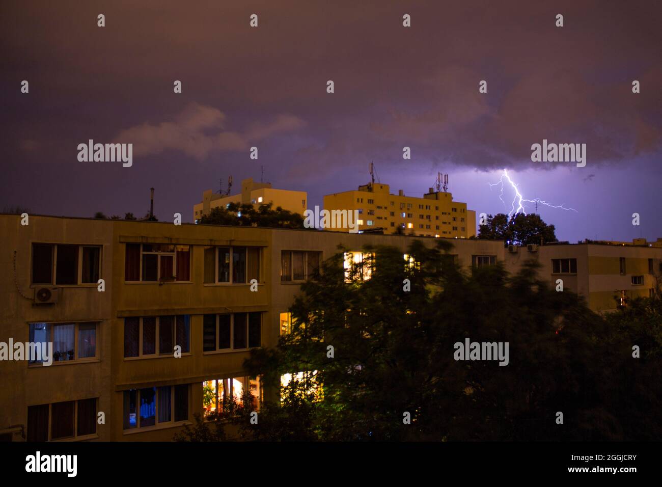 Bucharest neighbourhood during a thunderstorm at night. Stock Photo