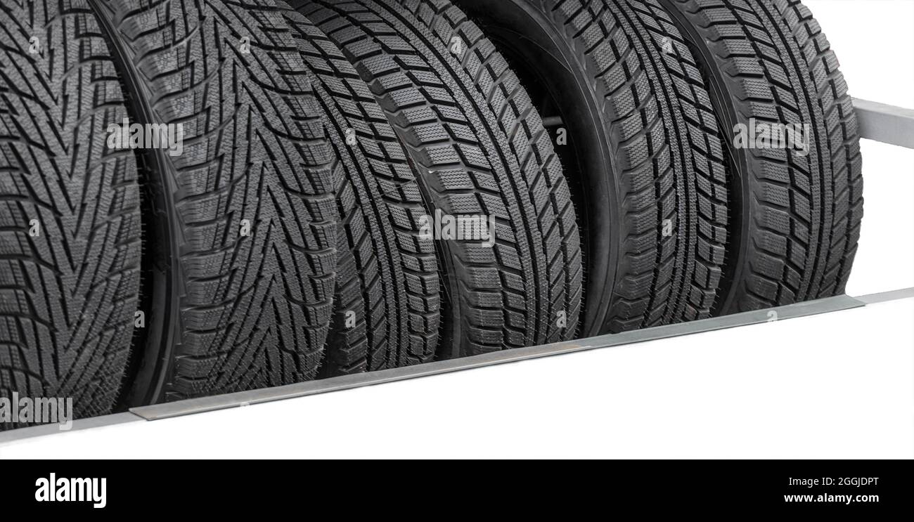 Car tires for the vehicle are stored for sale at the gas station Stock