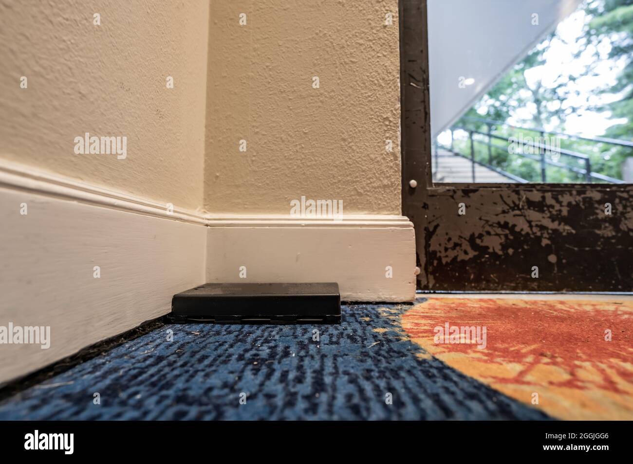 Professional pest control trap located in the entryway of a hotel Stock