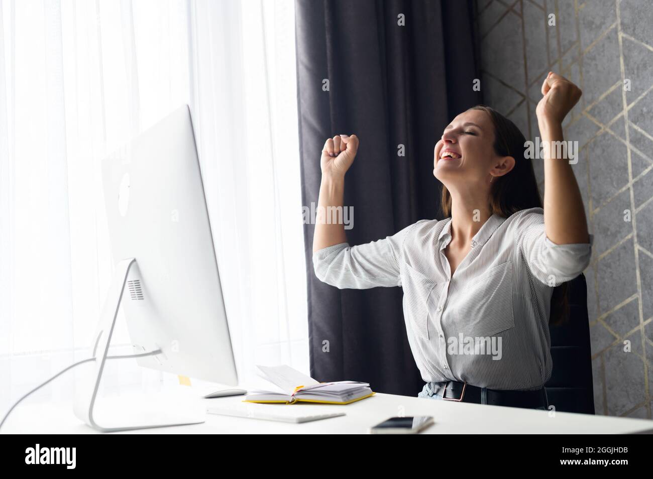Goal achievement. Hilarious overjoyed young woman scream yes and