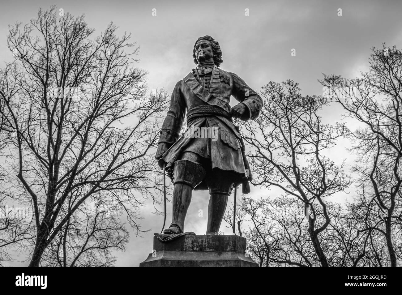 Monument to Peter the Great among the trees in the city of Kronstadt. Front view. Black and white. Stock Photo