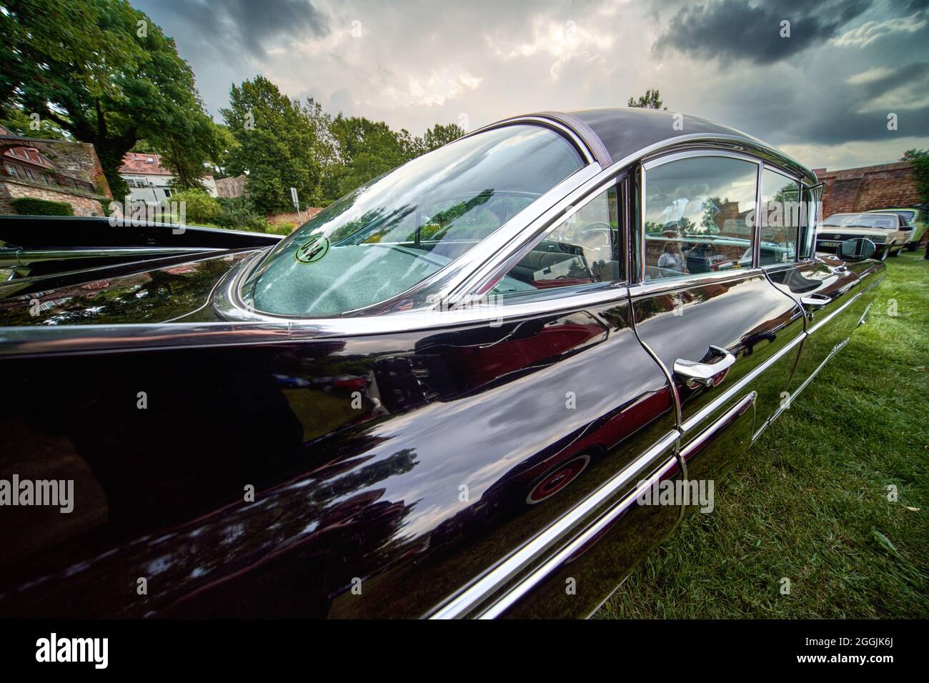 Cadillac Fleetwood, rear view of the classic American road cruiser from 1959 with large tail fins in Lehnin, Germany, August 21, 2021,illustrative edi Stock Photo