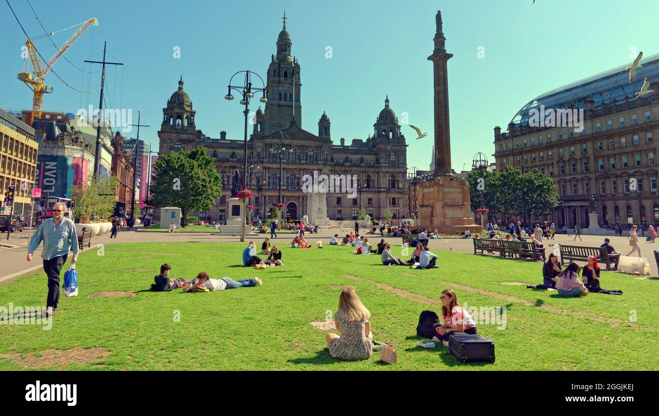 Glasgow, Scotland, UK, 1st September, 2021. UK  Weather: Sunny  weather change for the better over the city centre as covid lockdown is reviewed.  George square saw sunworshippers and people watchers as locals and tourists flocked to the city centre. Credit: Gerard Ferry/Alamy Live News Stock Photo