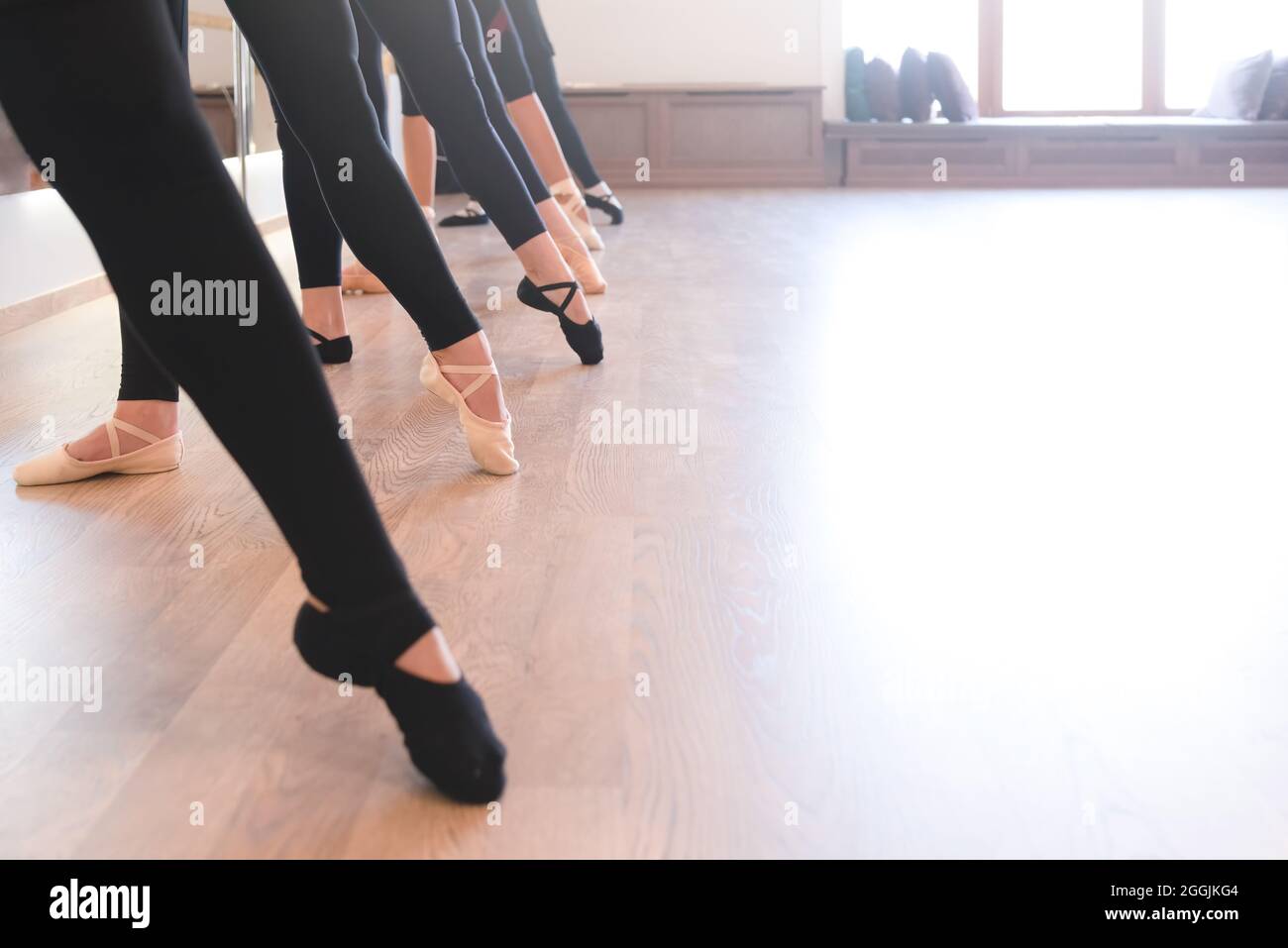 low section of The graceful legs of ballet dancers standing in a row on ...