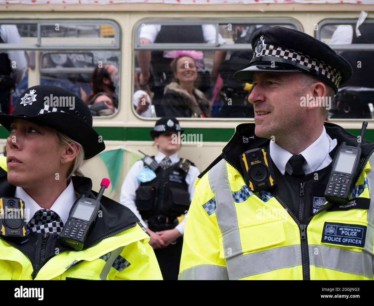 Extinction Rebellion activists London 31 August 2021. Protesters block London Bridge with a bus as part of ongoing XR, protests in London, while police officers guard bus with demonstrators on board Stock Photo