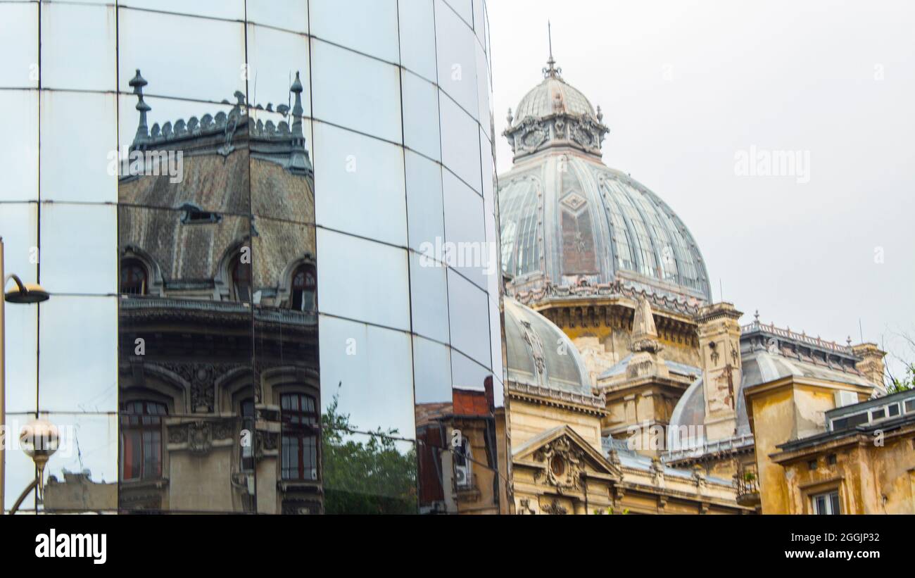Classic CEC Bank Palace near modern glass and steel BCR Bank building ...