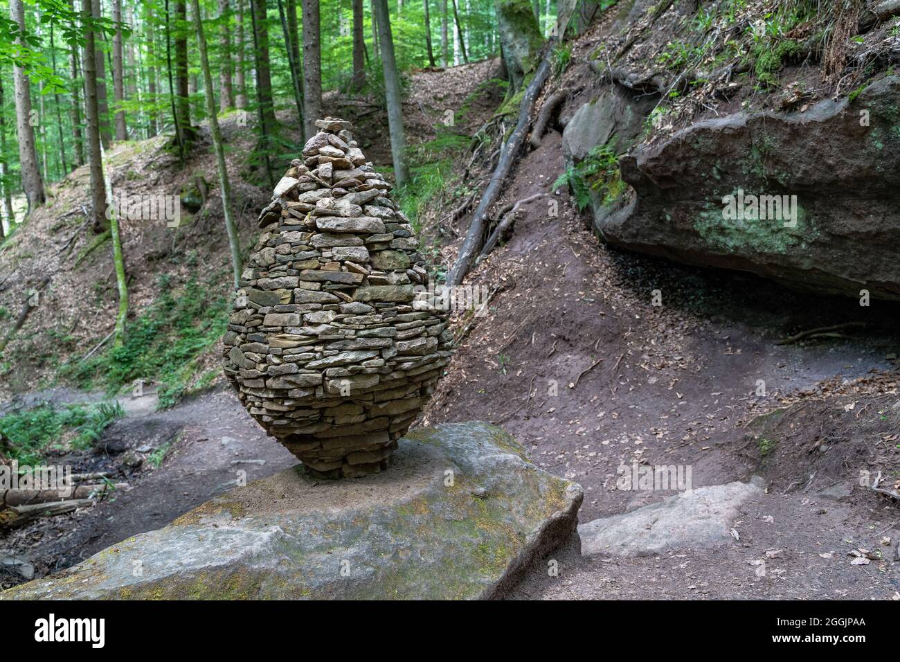 Europe, Germany, Baden-Wuerttemberg, Swabian-Franconian Forest, Spiegelberg, Artful cairn in the Tobel Gorge Stock Photo