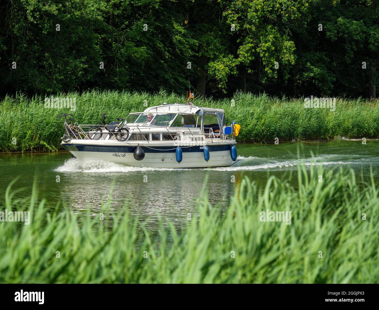 Motor yacht on the Mittelland Canal near Venne, Osnabrücker Land, Lower Saxony, Germany Stock Photo