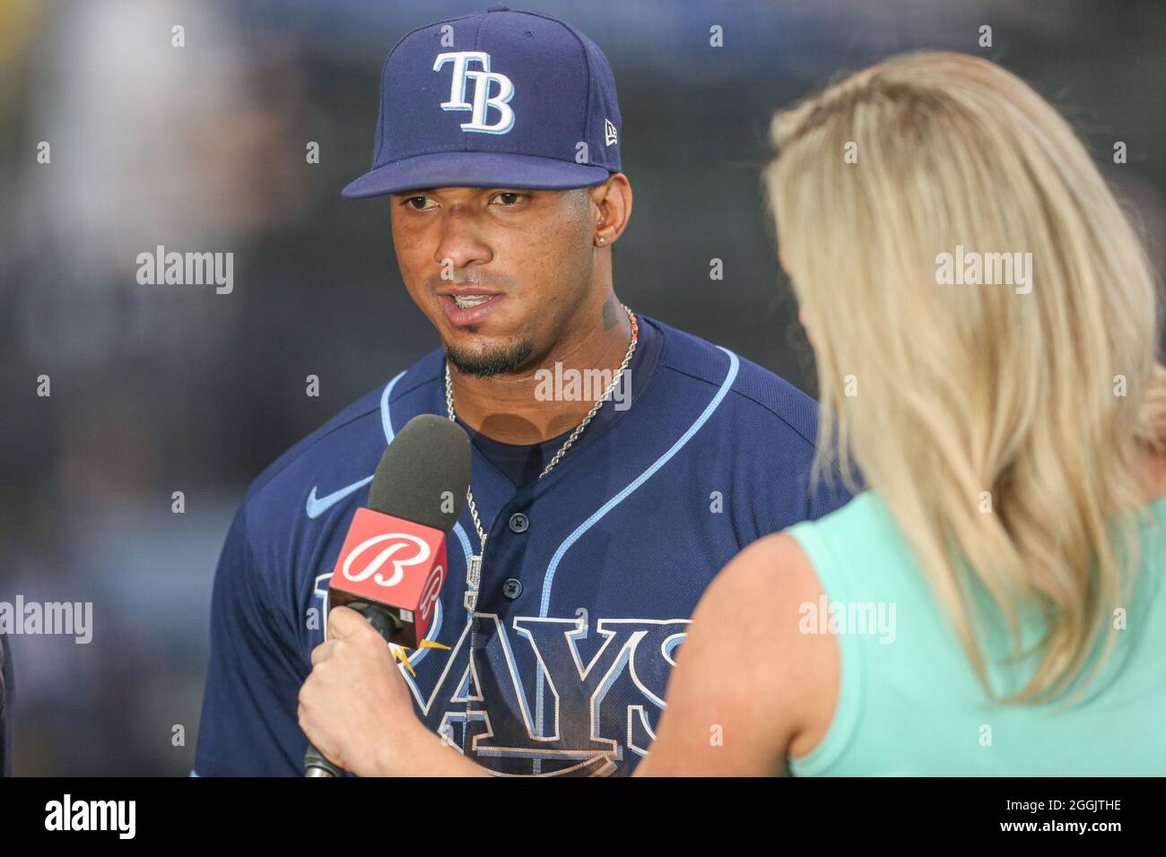 St. Petersburg, FL. USA;  Bally’s sports reporter Tricia Whitaker interviews Tampa Bay Rays shortstop Wander Franco (5) after a major league baseball Stock Photo