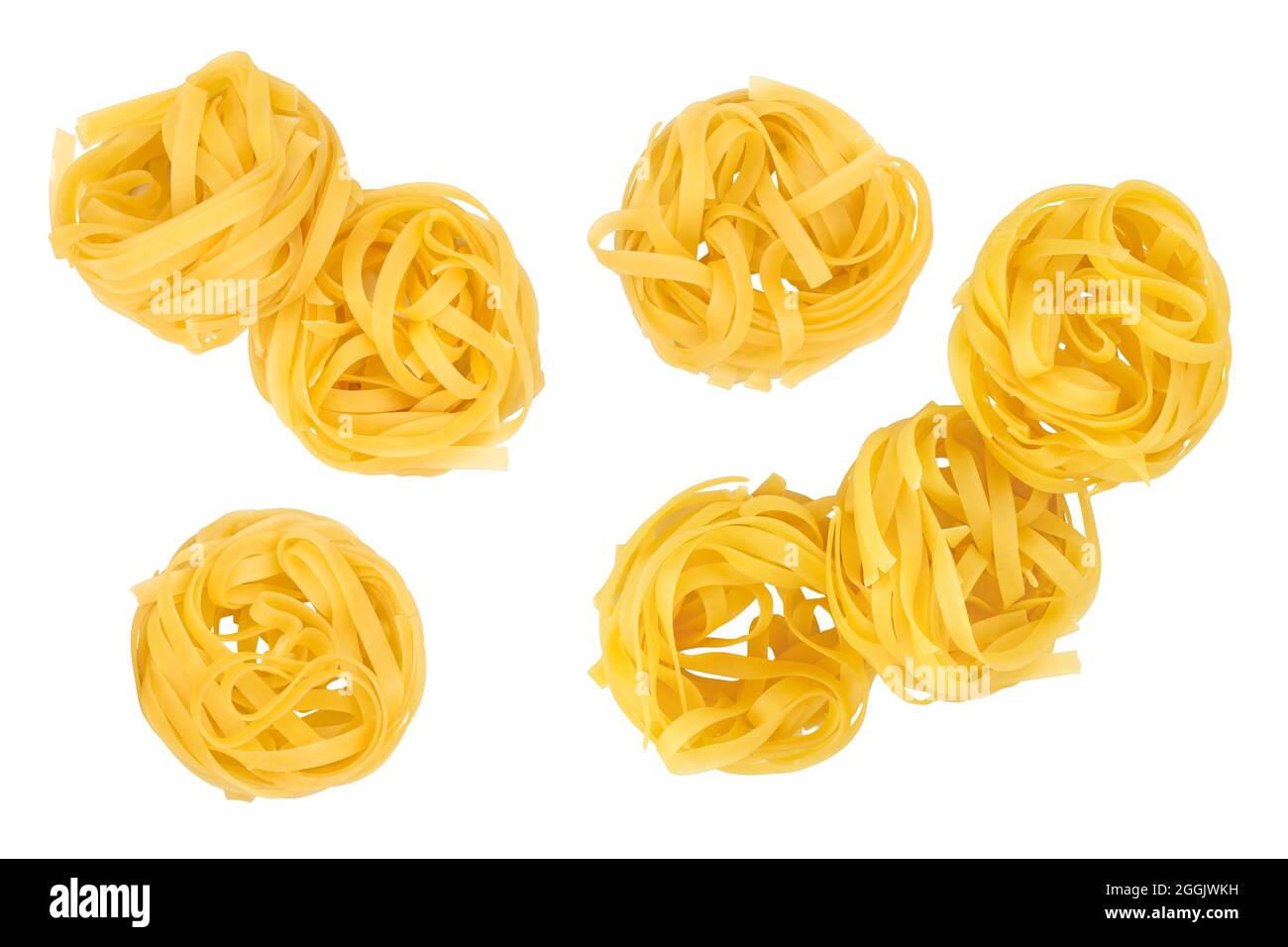 Raw tagliatelle pasta isolated on white background. Top view. Flat lay. Set or collection Stock Photo