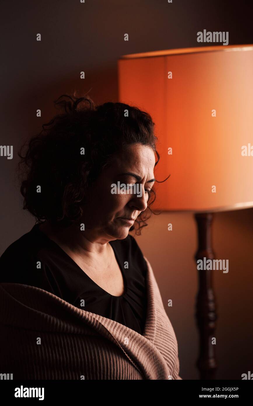 A middle-aged woman is alone with depression Stock Photo