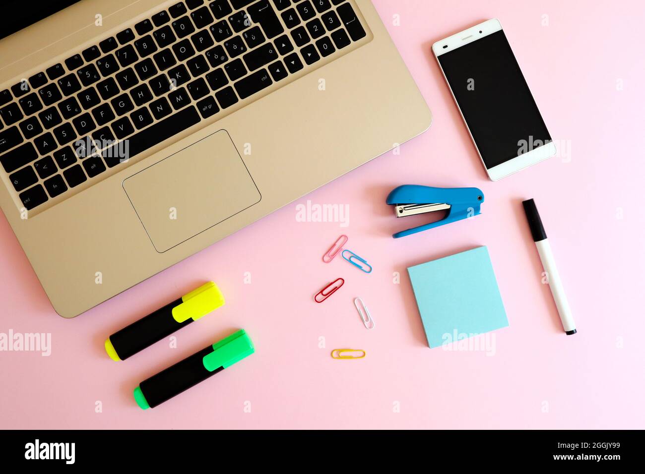 Stylish workspace with laptop computer, smartphone and modern office ...