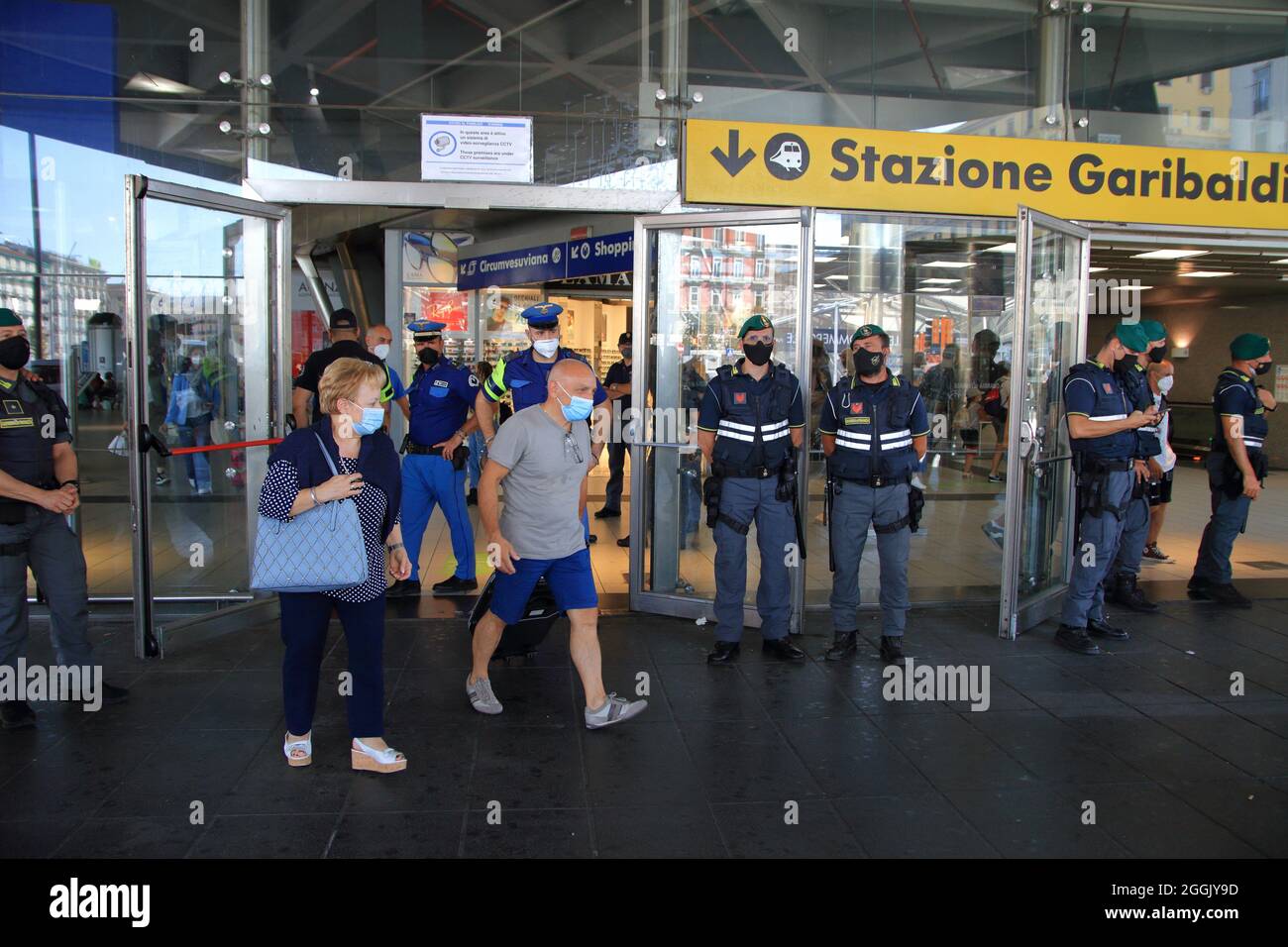 Entry into force of the possession of the green pass (certification of vaccination against covid-19) on long-distance trains. On the instructions of Interior Minister Lamorgese, to avoid protests of no-vax and no-green passes, all major Italian railway stations are manned by a large number of police forces . At the station of Naples closed all the various accesses. One access only for the entrance and one only for the exit from the station. Travelers forced to a long walk from the parking lot to the entrance and exit area. I've seen a lot of police and financial police officers. (Photo by Pas Stock Photo