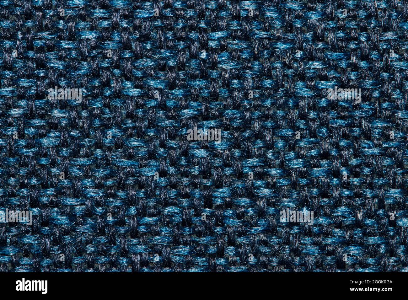 Navy blue fabric color swatch pattern with light colored flecks. Stock Photo