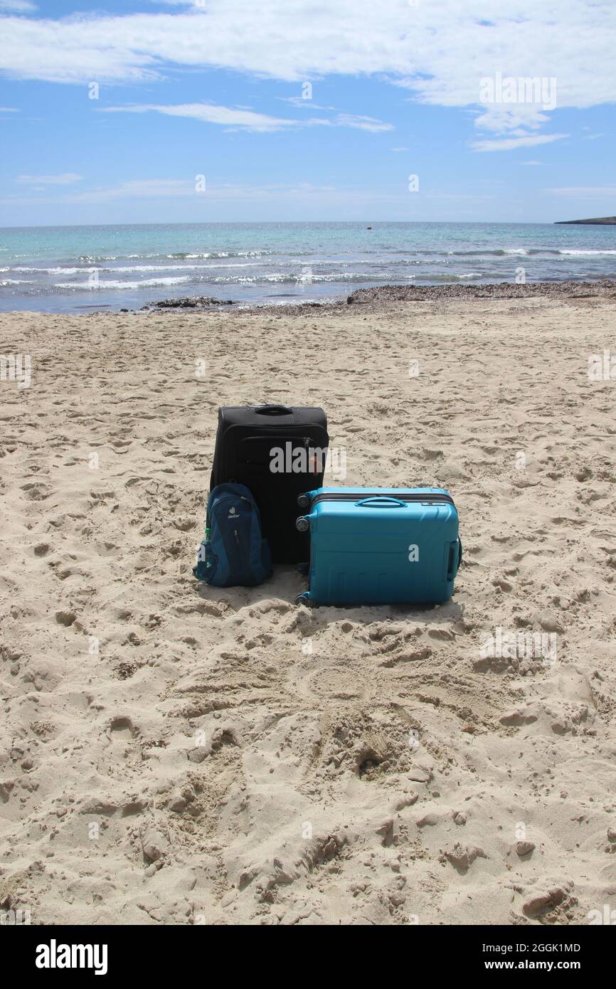 two lonely suitcases on the beach, vacation, Spain, Balearic Islands, Mallorca, Cala Millor Stock Photo