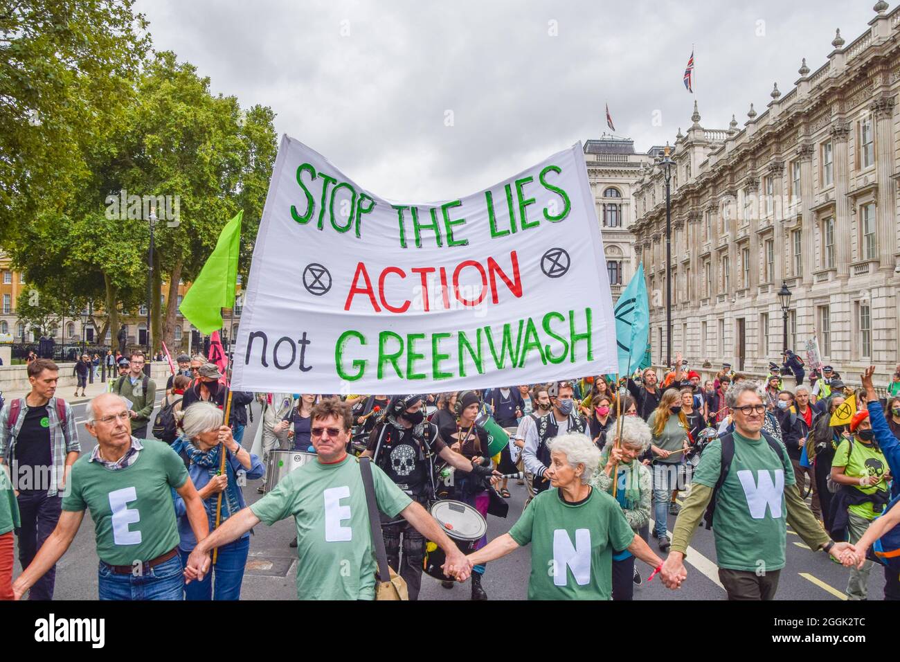London, UK. 01st Sep, 2021. Protesters carry a banner which says 'Stop The Lies - Action Not Greenwash' while marching during the demonstration outside Downing Street.Extinction Rebellion protesters staged a 'greenwash' protest in Westminster, part of their two-week Impossible Rebellion campaign calling on the UK Government to act meaningfully on the climate and ecological crisis. (Photo by Vuk Valcic/SOPA Images/Sipa USA) Credit: Sipa USA/Alamy Live News Stock Photo